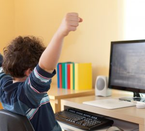 Boy using computer at home