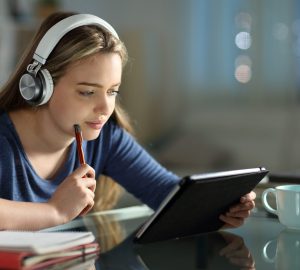 Student e-learning with tablet and headphones