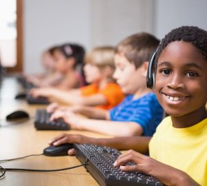 kids in computer lab doing universal screener for students